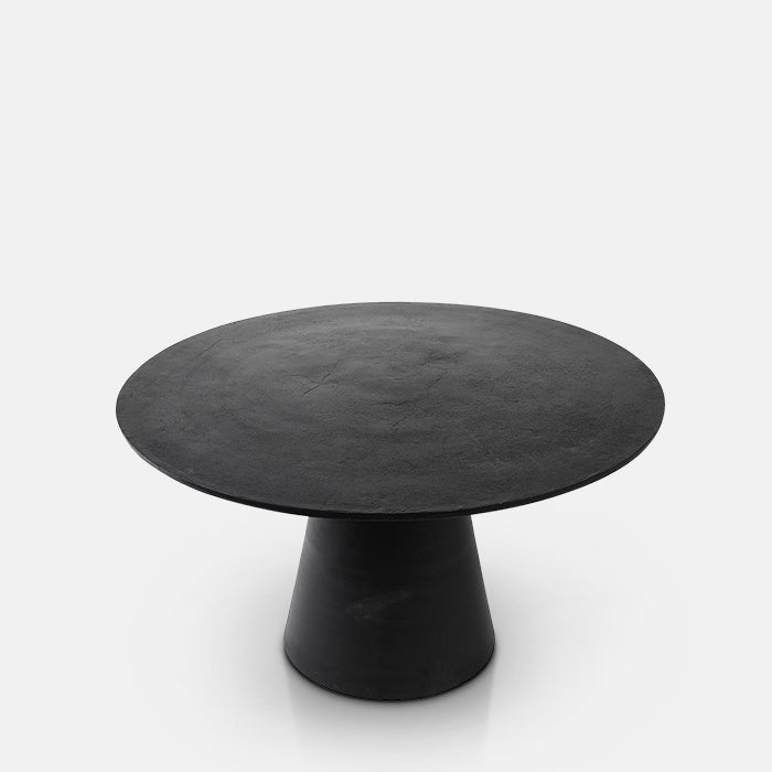 Contemporary black metal dining table in a round shape