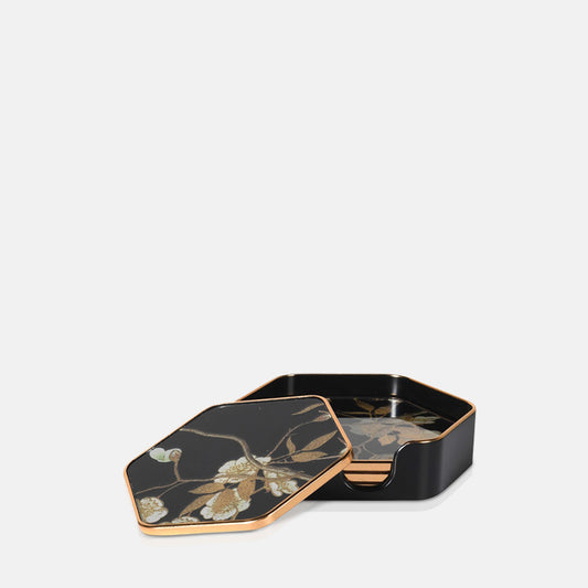 $ hexagonal gold and black floral patterned coasters in a black case