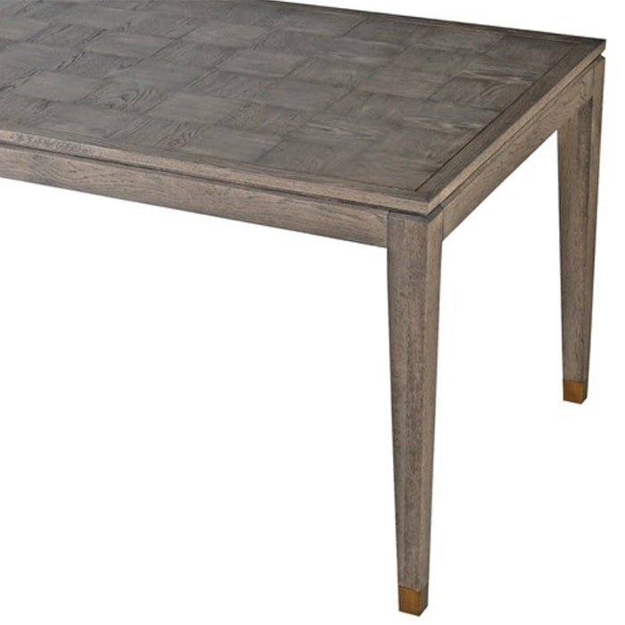 A closeup of the slim tapered legs on the frances Dining Table.