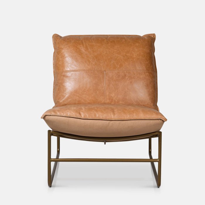 Granger occasinal chair, soft brown leather cushioning and a sculptural curved metal frame with a timeless design, made to bring comfort and effortless Abigail Ahern style to any room, 