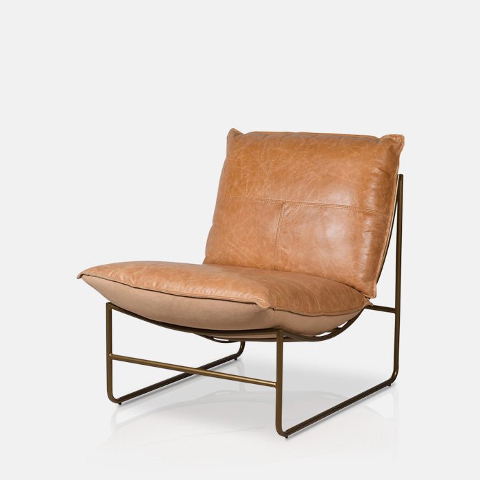 Granger occasinal chair, soft brown leather cushioning and a sculptural curved metal frame with a timeless design, made to bring comfort and effortless Abigail Ahern style to any room, 
