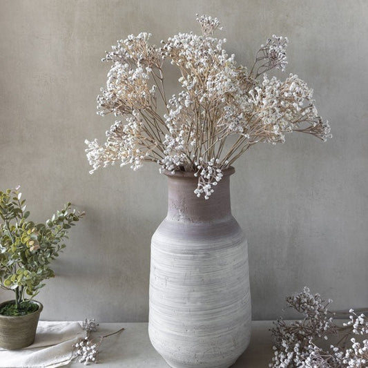Image of luxury artificial Gypsophila with delicate white flower buds, styled in one of our ceramic vases. A beautiful faux flower addition to any home, these floral bouquets look gorgeous in any room.
