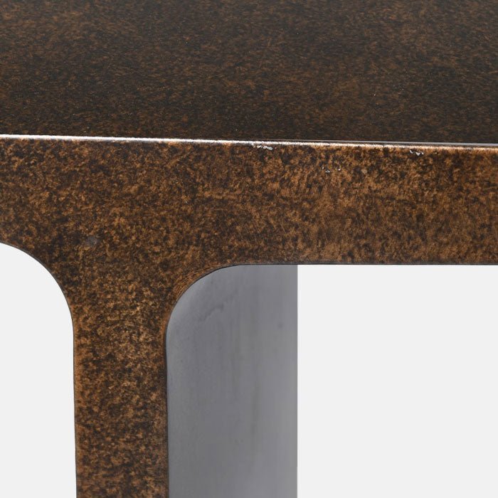 A closeup of the Harrow Console, showing the detail of the burnished iron finish.