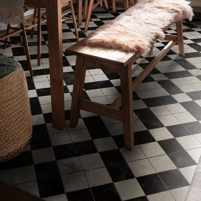 Black and white, cross shaped tiled pattern on a large vinyl floor rug