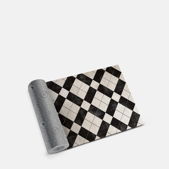 Black and white cross patterned vinyl flooring rolled up into a tube