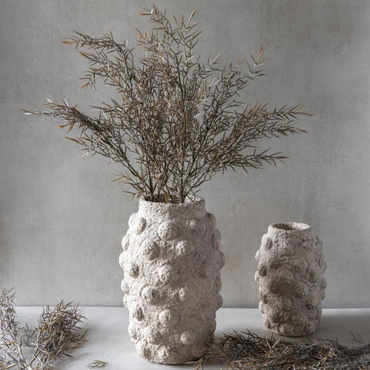 Image of Faux Honey Bracelet stems in a soft green and rust colour, styled in a textured Abigail Ahern vase. This artificial foliage adds a natural and earthy feel to your home.