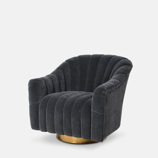 Armchair upholstered in blue-grey velvet, with simple round brass base.