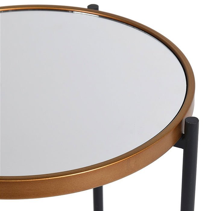 A closeup of the mirrored top of the Huxton Side Table.
