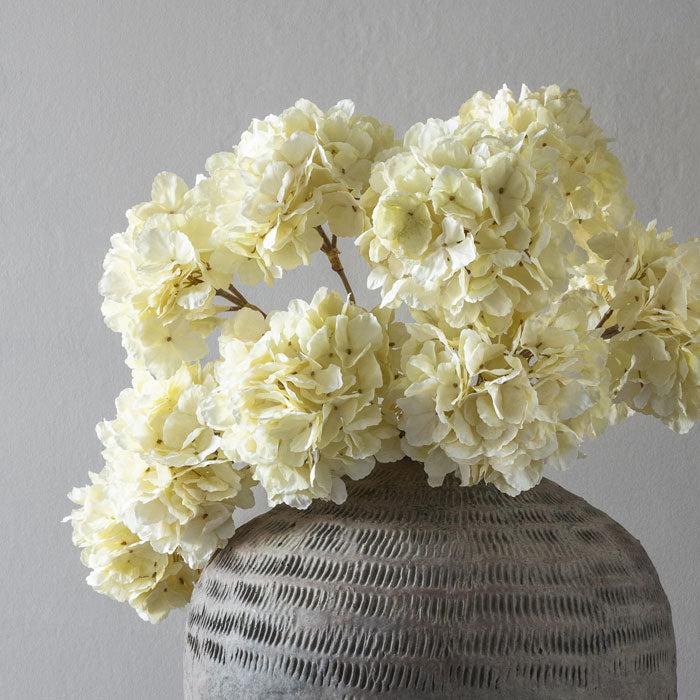 Closer image of the faux Hydrangeas from interior designer Abigail Ahern, in the colour Lace. A beautiful addition that adds style and a freshness to your home.