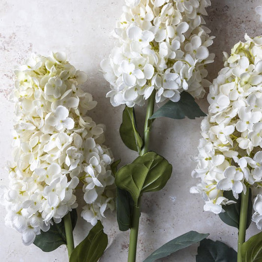 Detail image of some cream faux hydrangeas. These fake flowers are gorgeous on their own or in a faux bouquet.