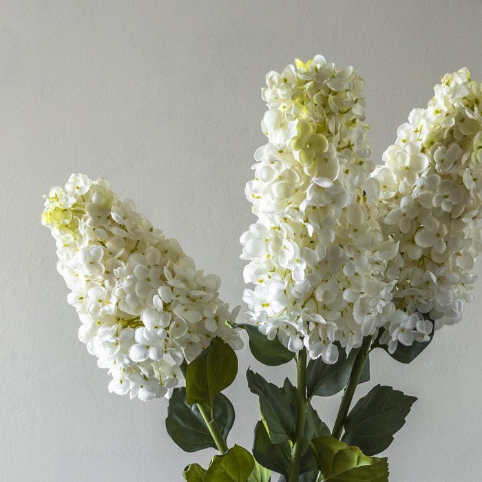 Faux bouquet made up of some cream hydrangea artificial flowers. 