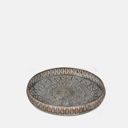 Round gold metal tray with a decorative cutout pattern