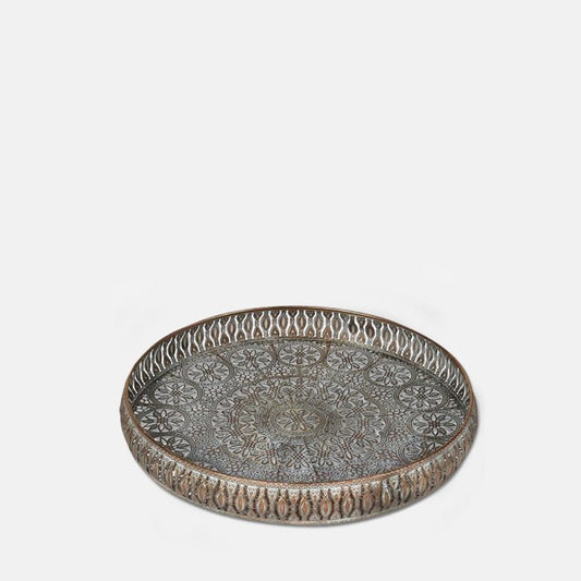 Round gold metal tray with a decorative cutout pattern