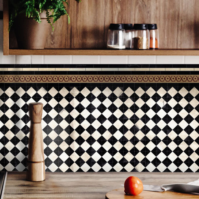 Black and white checkerboard patterned vinyl backsplash stickers along the back of a kitchen counter