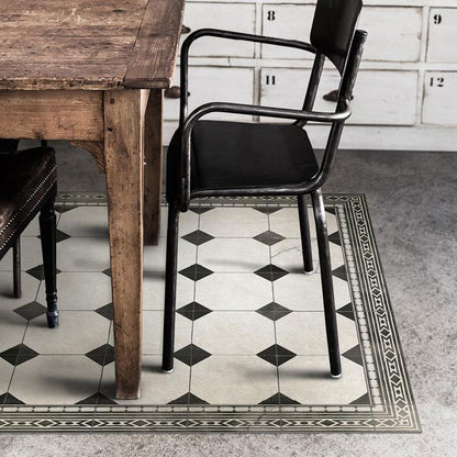 Black and white, large vinyl floor rug underneath a wooden dining table
