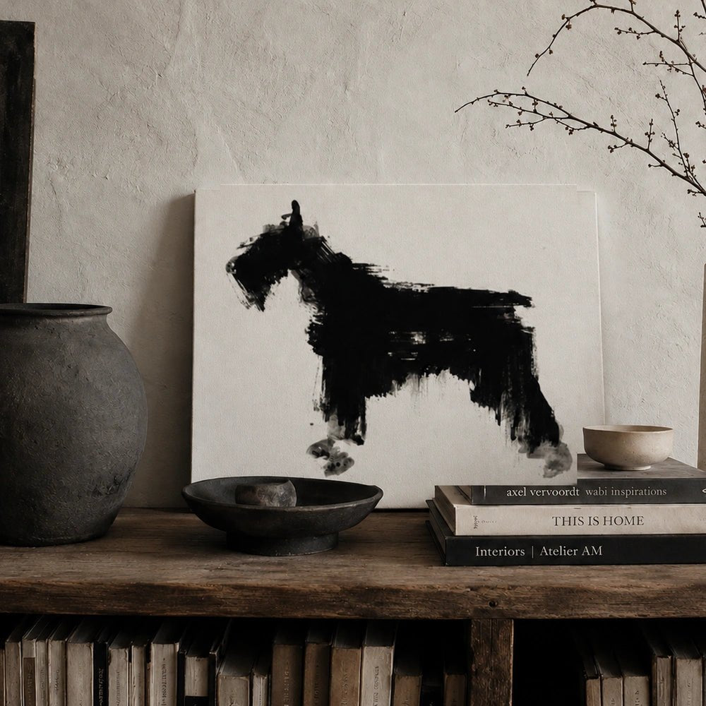 Jasper Dog Print displayed on a wall above a dark console, styled with lamps and decorative objects in a warm contemporary interior setting.
