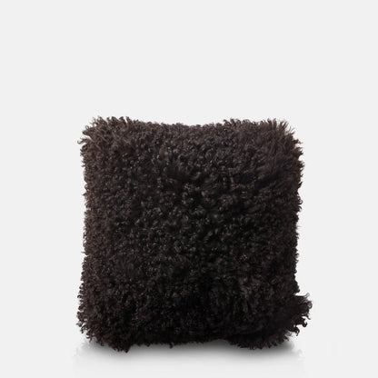 Shaggy black sheepskin cushion in a square shape
