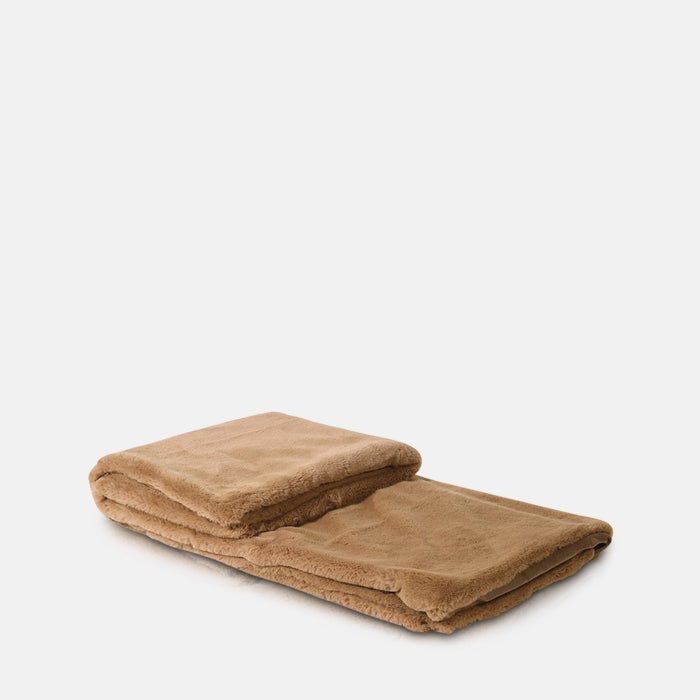 A cutout of the Kanan Throw, a caramel coloured soft faux fur throw.