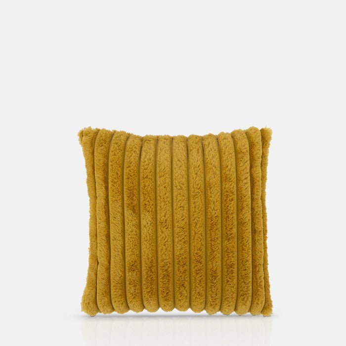 A cutout of the Kinsley Cushion, a square cushion in vibrant mustard coloured faux fur with ridged detail.