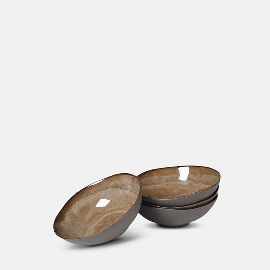 Set of four stoneware bowls with matte exterior glaze and variegated gloss brown interior glaze.