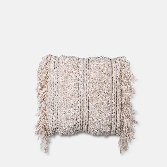 A cutout of the Lisbon Tufted Cushion, a cream tufted cotton cushion with fringe edges.