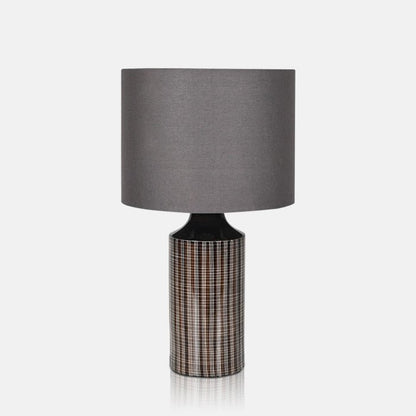 Textured grey ceramic lamp with a round grey lampshade