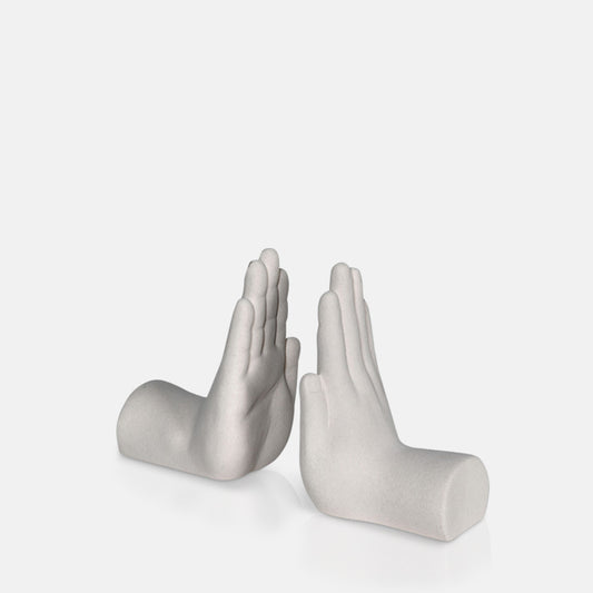 Two white bookends shaped like a hand