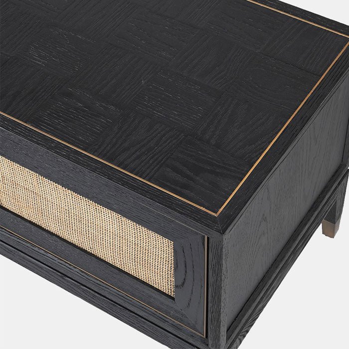Black wooden parquet style side cabinet with rattan doors and gold details
