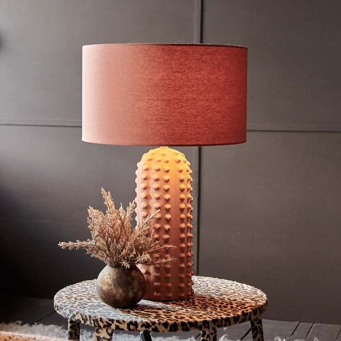 Maynard Table, a coral hued linen shade and a bubble textural ceramic base table lamp styled on a leopard print side table.