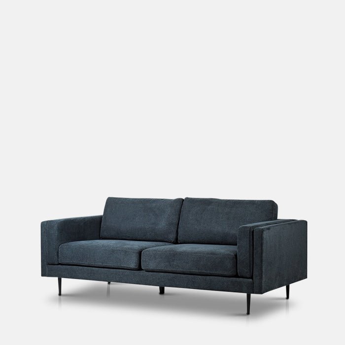 The Medford 3 Seater Sofa, an angular design sofa in a deep inky blue velvet.