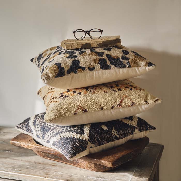 Set of 3 patterned cushions in cool colours and natural tones. Printed cushions with vintage style patterns sold as a set of 3 to add a boho style to your home.