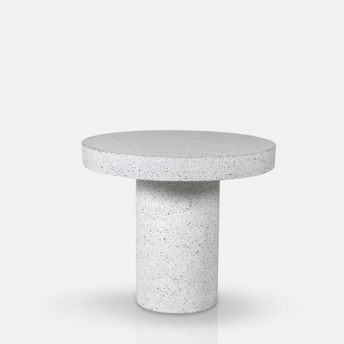 Round white terrazzo dining table with grey specks