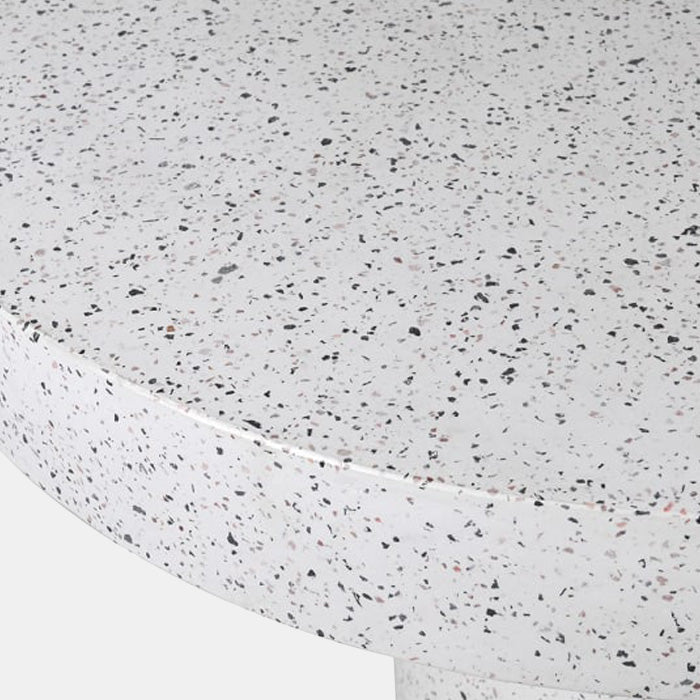 White round dining table with a mix of grey and brown terrazzo pieces