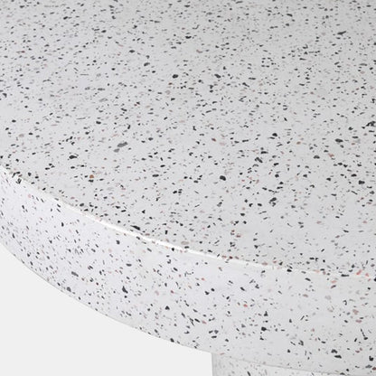 White round dining table with a mix of grey and brown terrazzo pieces