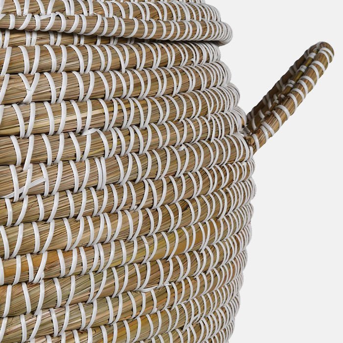 Contrast white stitching around the woven grass basket with a matching handle