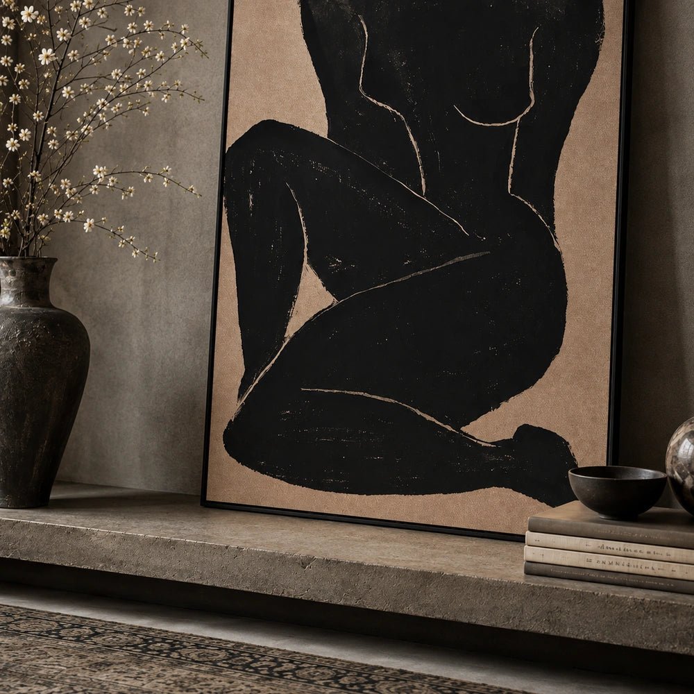 Namora Canvas Print shown close up above a dark console, featuring an expressive neutral portrait with layered brushwork beside sculptural vessels and dried foliage.