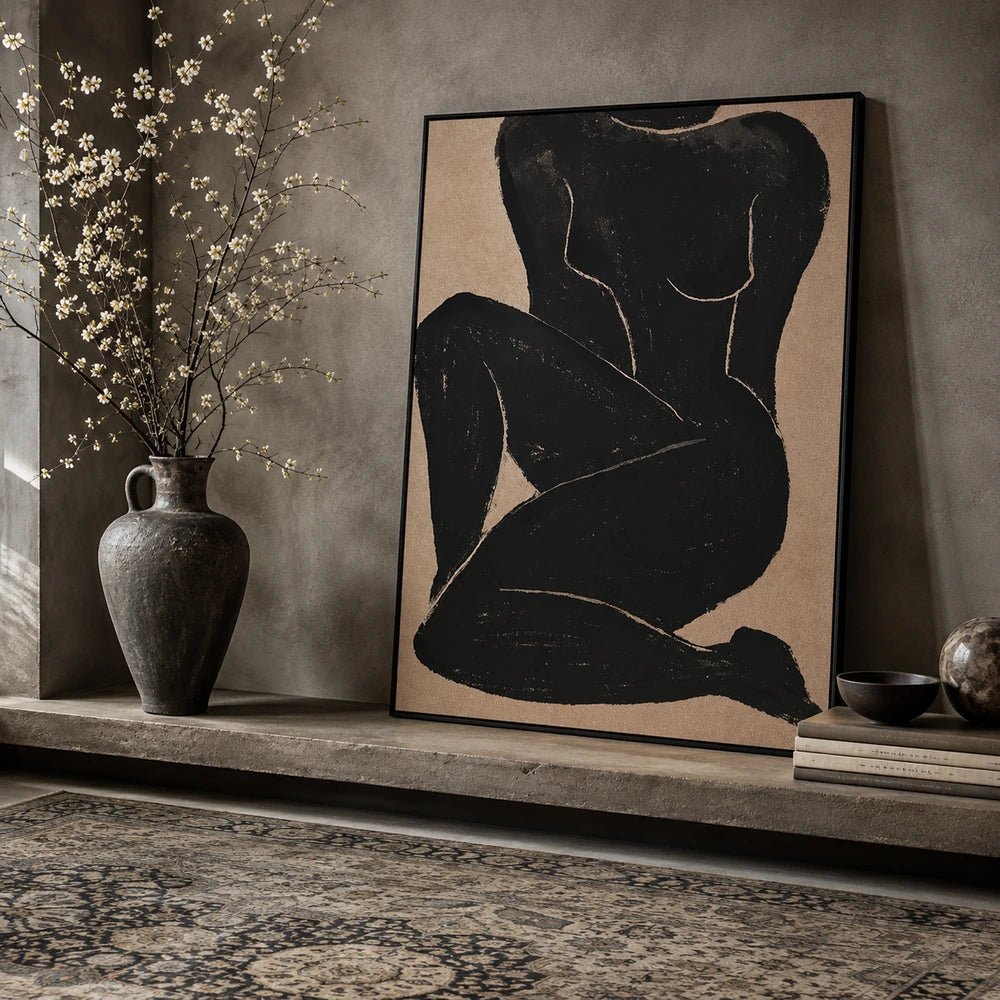 Namora Canvas Print displayed in a warm neutral room above a dark console, styled with sculptural ceramics, dried branches, books and softly textured furnishings.