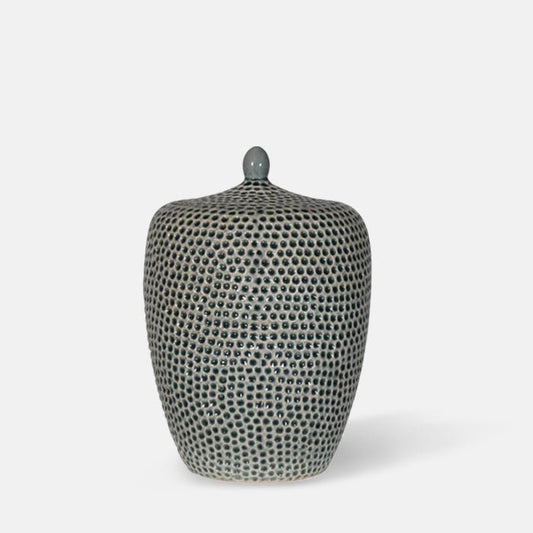 Tall ceramic storage jar in green with a honeycomb texture