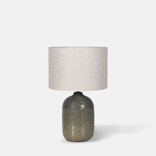 Table lamp with olive green glazed base and oat coloured drum shade.