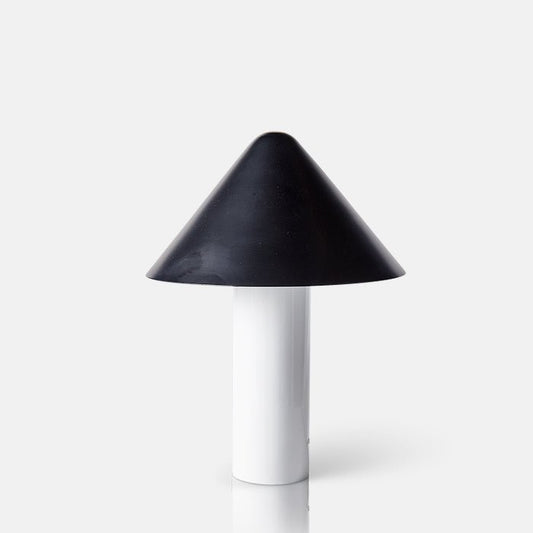 Table lamp with white cylindrical base and black cone shaped dome shade.