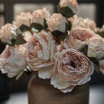 Luxury artificial peony flowers in a soft blush colour. These lifelike flowers add a chic look to any home decor style, and look stunning in a flower arrangement or add a natural garden flowers look to an earthy vase. Realistic artificial flowers with 2 blousy blooms and a bud on each stem.