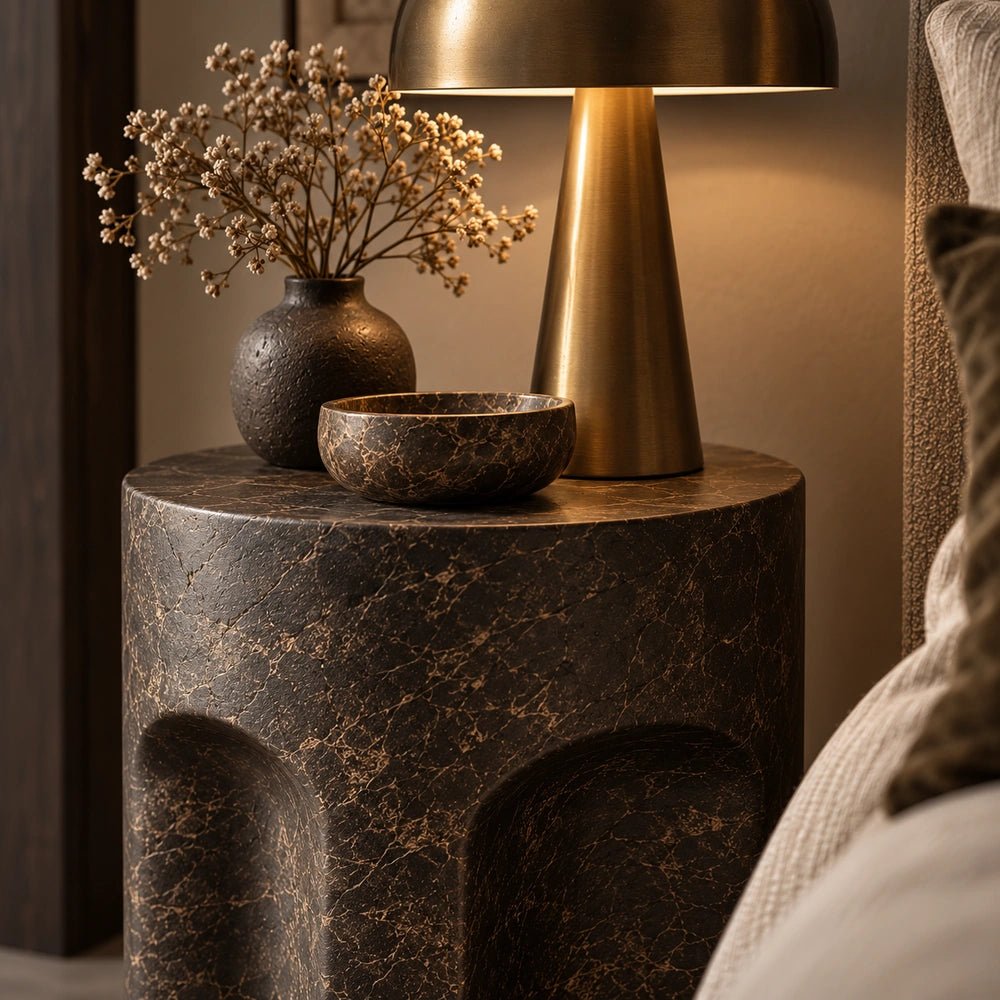 Pinch Round Side Table styled beside a neutral sofa with a cream lamp, ceramic vases and warm textured furnishings in a contemporary living room.