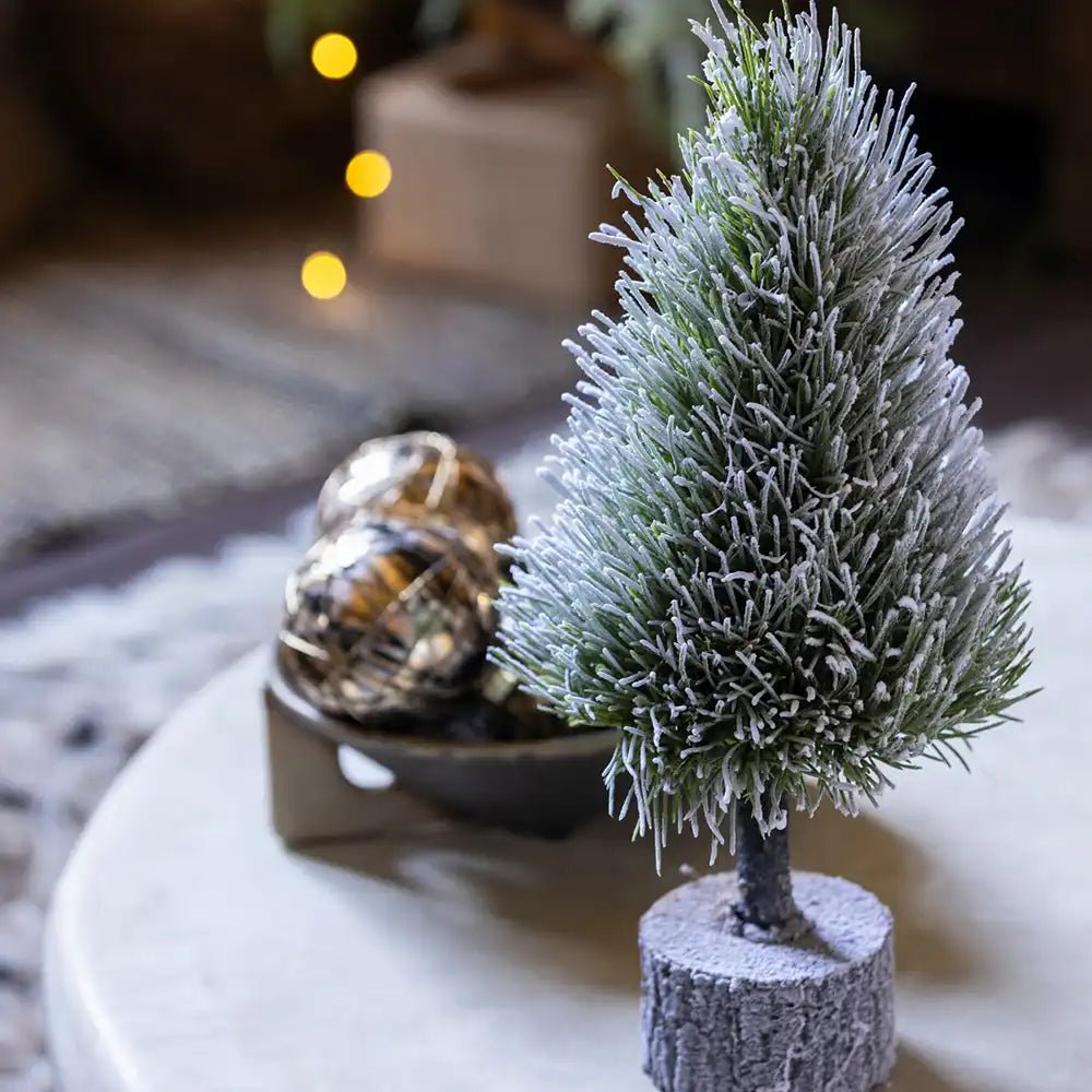 Pre-Lit Mini Christmas Tree decorated for a festive holiday ambiance, with a portable lamp in the background.