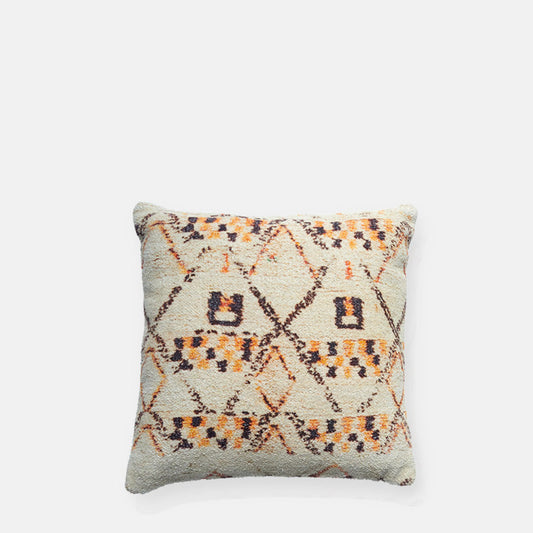 Square cream cushion with an orange and purple diamond pattern