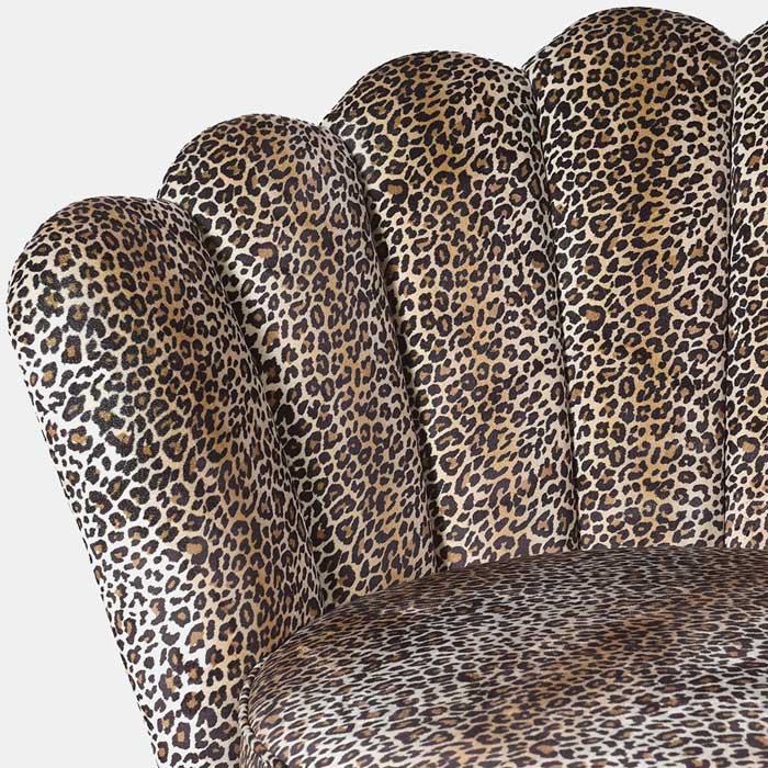 A closeup of the cushioned panels on the Reno Leopard Print Armchair.