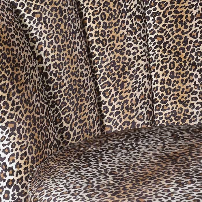 A closeup of the cushioned panels on the Reno Leopard Print Armchair.
