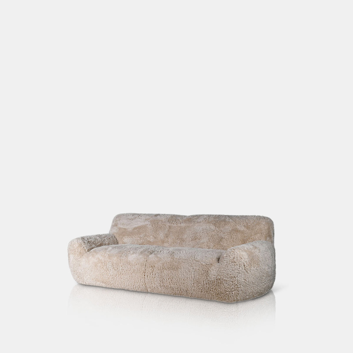 Cream faux sheepskin sofa with a plush textured finish, generous three seater design and deep comfortable cushioning. Saskia Sofa by Abigail Ahern, featuring a luxurious soft-touch upholstery and contemporary silhouette designed for relaxed lounging and stylish living spaces. A statement designer sofa perfect for modern living rooms and luxury interiors, adding warmth, texture and a cosy sophisticated feel to contemporary home decor..