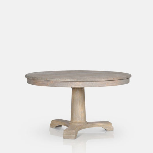Round wooden dining table with a classic pedestal base