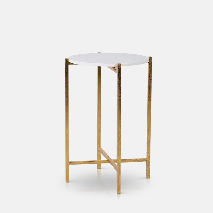 Round side table with white stone-look top and gold metal frame.