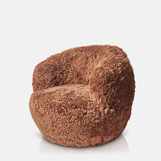 Shaggy, fur armchair in chestnut brown.